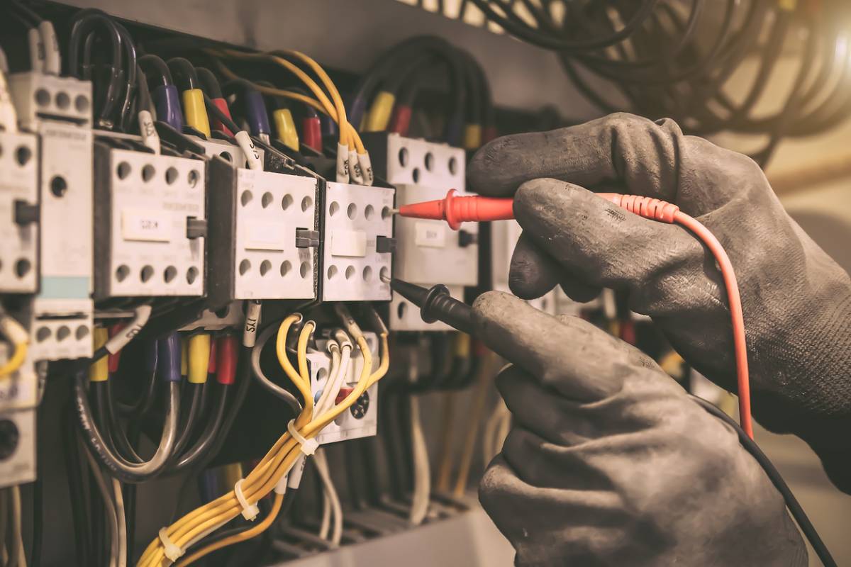 Man working to stop electrical equipment failure.